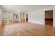 Spacious living room featuring gleaming hardwood floors and custom built-in shelving at 1926 Parkwood Rd, Snellville, GA 30078