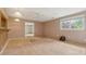 Spacious living room with plywood flooring and natural light from the window at 1926 Parkwood Rd, Snellville, GA 30078
