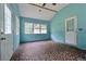 Sunroom with brown tile flooring, with many windows and two doors at 1926 Parkwood Rd, Snellville, GA 30078