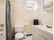 Standard bathroom features shower-tub combo, sink with vanity, mirror, modern lighting, and toilet at 2715 Braemore Gln, Powder Springs, GA 30127