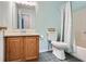 Bathroom featuring a vanity, toilet, shower and tub combination with light blue tiling and wall paint at 2715 Braemore Gln, Powder Springs, GA 30127