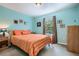 Cozy bedroom with bright paint, large window and a queen bed with a decorative patterned comforter at 2715 Braemore Gln, Powder Springs, GA 30127