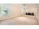 Large bonus room with two windows and a ceiling fan, offering versatile living space at 2715 Braemore Gln, Powder Springs, GA 30127