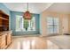 Cozy dining area featuring a bay window, wood floors, and natural light at 2715 Braemore Gln, Powder Springs, GA 30127