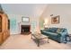 Bright living room with a fireplace, plush carpeting, and comfortable seating at 2715 Braemore Gln, Powder Springs, GA 30127