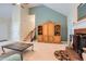 Spacious living room with a fireplace, built-in shelving, and a staircase at 2715 Braemore Gln, Powder Springs, GA 30127