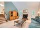Inviting living room featuring a brick fireplace, vaulted ceiling, and staircase at 2715 Braemore Gln, Powder Springs, GA 30127