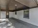 Covered back porch with painted brick, perfect for enjoying the outdoors at 2903 Monterey Dr, Decatur, GA 30032