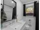 Well-lit bathroom with modern sink, mirror, and shower at 2903 Monterey Dr, Decatur, GA 30032