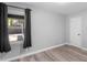 Well-lit bedroom with wood floors and a backyard view at 2903 Monterey Dr, Decatur, GA 30032