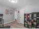 Inviting bedroom with grey walls, hardwood floors, and open shelving at 2903 Monterey Dr, Decatur, GA 30032
