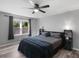 Spacious bedroom with ceiling fan and a view of the surrounding trees at 2903 Monterey Dr, Decatur, GA 30032
