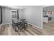 Dining area features modern flooring, a stylish table set, and neutral wall paint at 2903 Monterey Dr, Decatur, GA 30032