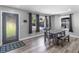 Bright dining room with modern flooring, a stylish table set, and natural light at 2903 Monterey Dr, Decatur, GA 30032