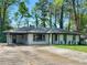 Charming single-story home with a covered parking area and well-maintained lawn at 2903 Monterey Dr, Decatur, GA 30032