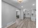 Open layout, the kitchen features sleek white cabinets, stainless steel appliances, and modern flooring at 2903 Monterey Dr, Decatur, GA 30032