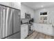 Well-appointed kitchen featuring white cabinetry, stainless steel appliances, and sleek countertops at 2903 Monterey Dr, Decatur, GA 30032