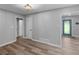 Open concept view between dining room, entryway and living room. Modern upgrades at 2903 Monterey Dr, Decatur, GA 30032