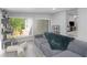 Bright living room area with lots of sunlight, gray couch and cat tree at 2903 Monterey Dr, Decatur, GA 30032