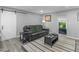 Cozy living room with a modern sliding door, a striped rug, and comfortable seating at 2903 Monterey Dr, Decatur, GA 30032