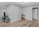 Living room area with new flooring, neutral paint and an adjacent sitting area at 2903 Monterey Dr, Decatur, GA 30032