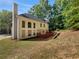 Two-story home featuring a spacious backyard with a wooden deck at 3832 Cherry Ridge Blvd, Decatur, GA 30034