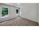 Bedroom with neutral walls, bright windows and carpet flooring at 3832 Cherry Ridge Blvd, Decatur, GA 30034