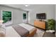 Cozy staged bedroom with natural light, modern decor, and a comfortable bed at 3832 Cherry Ridge Blvd, Decatur, GA 30034