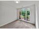 Cozy room with carpeted flooring, large windows with backyard views and neutral colored walls at 3832 Cherry Ridge Blvd, Decatur, GA 30034