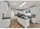 Modern kitchen features white cabinetry, stainless steel appliances, and tiled floors at 3832 Cherry Ridge Blvd, Decatur, GA 30034