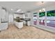 Bright, open kitchen with granite countertops, stainless steel appliances, tile flooring and large windows overlooking a deck at 3832 Cherry Ridge Blvd, Decatur, GA 30034