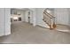 Spacious living room features neutral walls, carpeted flooring, arched entryways, and glass doors to an outdoor area at 3832 Cherry Ridge Blvd, Decatur, GA 30034