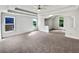 Spacious main bedroom featuring tray ceiling, neutral carpet, and windows at 3832 Cherry Ridge Blvd, Decatur, GA 30034