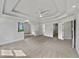 Bright main bedroom with tray ceilings, neutral carpet, and entrances to bathroom and closet at 3832 Cherry Ridge Blvd, Decatur, GA 30034