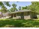 Charming brick ranch-style home with mature trees and a lush, well-manicured front lawn in a desirable neighborhood at 762 Rockbridge Nw Rd, Lilburn, GA 30047