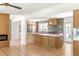 Open-concept kitchen with quartz countertops, modern appliances, designer lighting and island seating at 762 Rockbridge Nw Rd, Lilburn, GA 30047