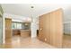 Open layout with wood floors and view of kitchen beyond a decorative screen at 762 Rockbridge Nw Rd, Lilburn, GA 30047