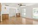 Bright living room with hardwood floors, custom built-ins and natural light from large windows at 762 Rockbridge Nw Rd, Lilburn, GA 30047