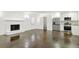 Spacious living room with a fireplace, stainless steel appliances, and dark stained concrete floors at 762 Rockbridge Nw Rd, Lilburn, GA 30047