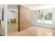Open layout with wood floors and view of dining room beyond a decorative screen at 762 Rockbridge Nw Rd, Lilburn, GA 30047