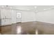 Bright living room featuring polished concrete floors, recessed lighting and an open concept to a modern, clean kitchen at 762 Rockbridge Nw Rd, Lilburn, GA 30047