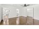 Main bedroom features polished concrete floors, a ceiling fan and a large closet with doors to adjoining rooms at 762 Rockbridge Nw Rd, Lilburn, GA 30047