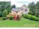 Charming backyard view showcasing a spacious wooden deck and well-maintained green lawn with mature trees at 1047 Taso Trl, Acworth, GA 30101