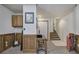 Finished basement with wood paneling, carpet and an entrance to an upstairs carpeted staircase at 1047 Taso Trl, Acworth, GA 30101
