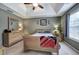 Comfortable bedroom with vaulted ceilings, a cozy bed, and a window for natural light at 1047 Taso Trl, Acworth, GA 30101