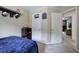 This is a cozy bedroom with neutral colored walls, trim, and carpeting, and a fun basketball net on the door at 1047 Taso Trl, Acworth, GA 30101