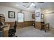 This is a well-lit room featuring wood paneling on the walls and neutral carpeting at 1047 Taso Trl, Acworth, GA 30101