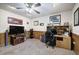 This bonus room features a television and wood paneling, creating a cozy space to relax or work at 1047 Taso Trl, Acworth, GA 30101
