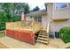 Lovely wooden deck, ideal for outdoor entertaining and relaxation, with a view of the home's exterior at 1047 Taso Trl, Acworth, GA 30101