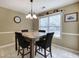 Cozy dining area with a modern light fixture and a bright window at 1047 Taso Trl, Acworth, GA 30101